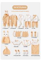 Set of 26 baby clothing and quilt items with labels on a white background