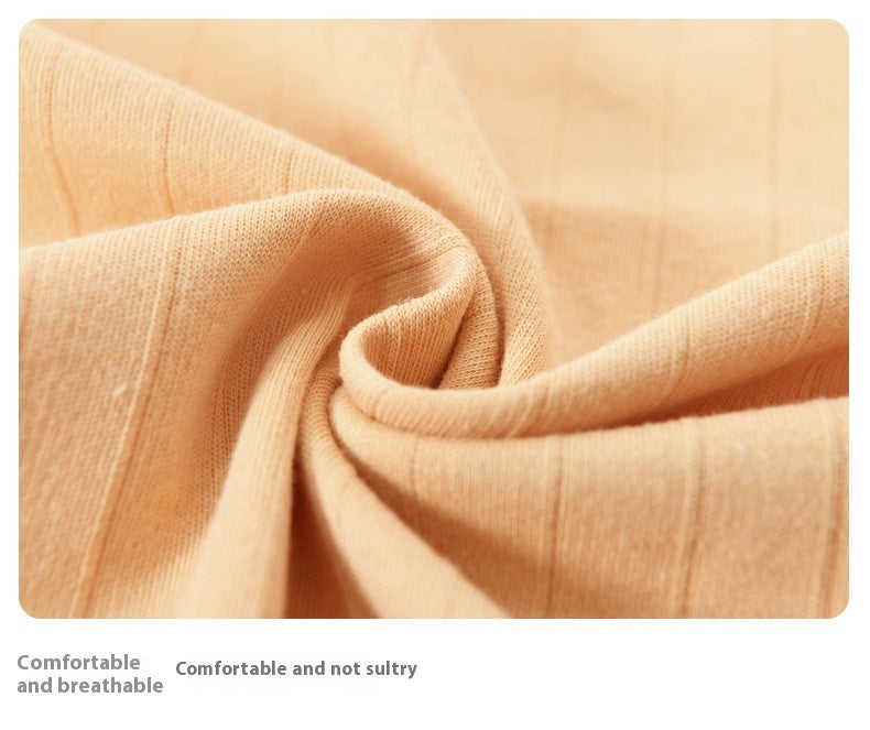 Close-up of peach-colored fabric with text describing comfort and breathability.