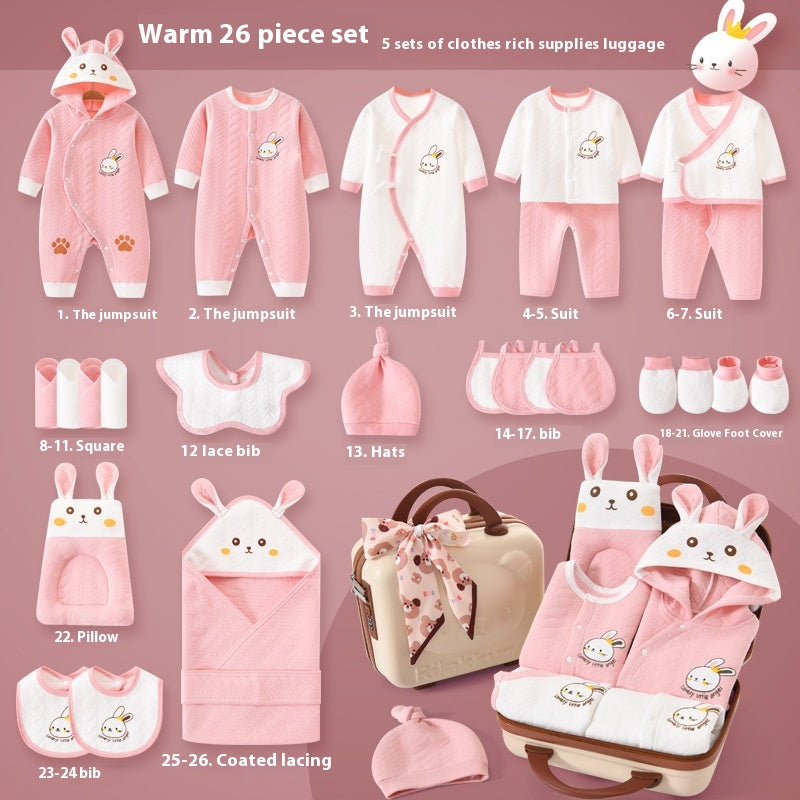 Baby clothing and accessory set with pink and white designs on a pink background